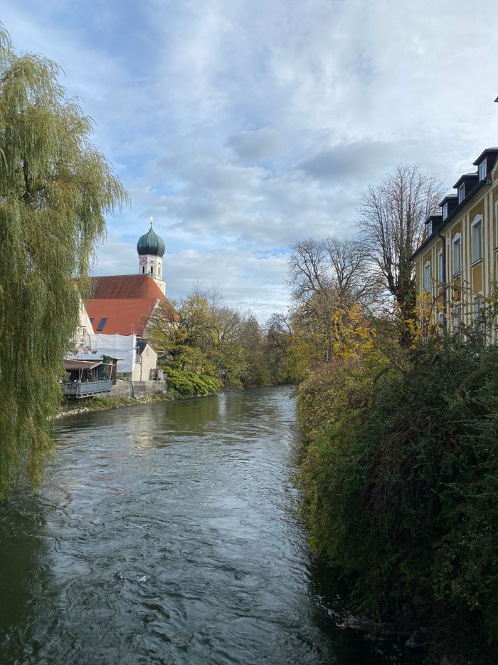 Beautiful view of the Amper River and historic architecture in Fürstenfeldbruck, Germany.